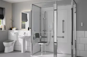Modern bathroom with a sleek glass shower featuring a built-in seat and safety rails, demonstrating Bayside Builders Group's expertise in accessible and stylish bathroom renovations in the Bay Area.