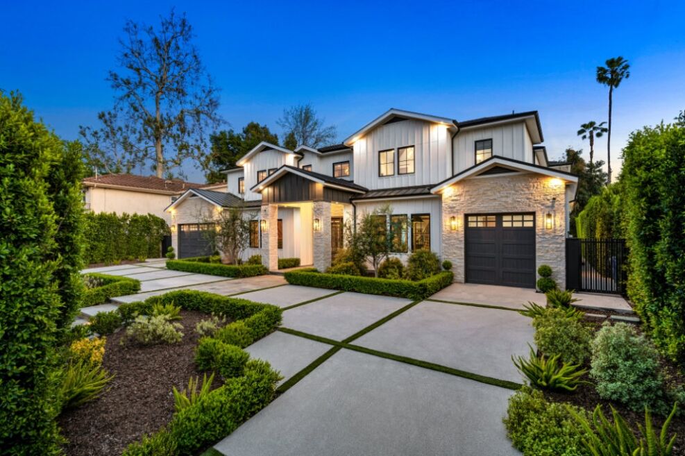A modern two-story home with a landscaped front yard, showcasing Bayside Builders Group’s expertise in Bay Area home remodeling and exterior design.