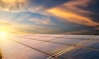 Solar panels absorbing sunlight at sunset, highlighting Bayside Builders Group's commitment to incorporating sustainable energy solutions in Bay Area home remodeling projects.